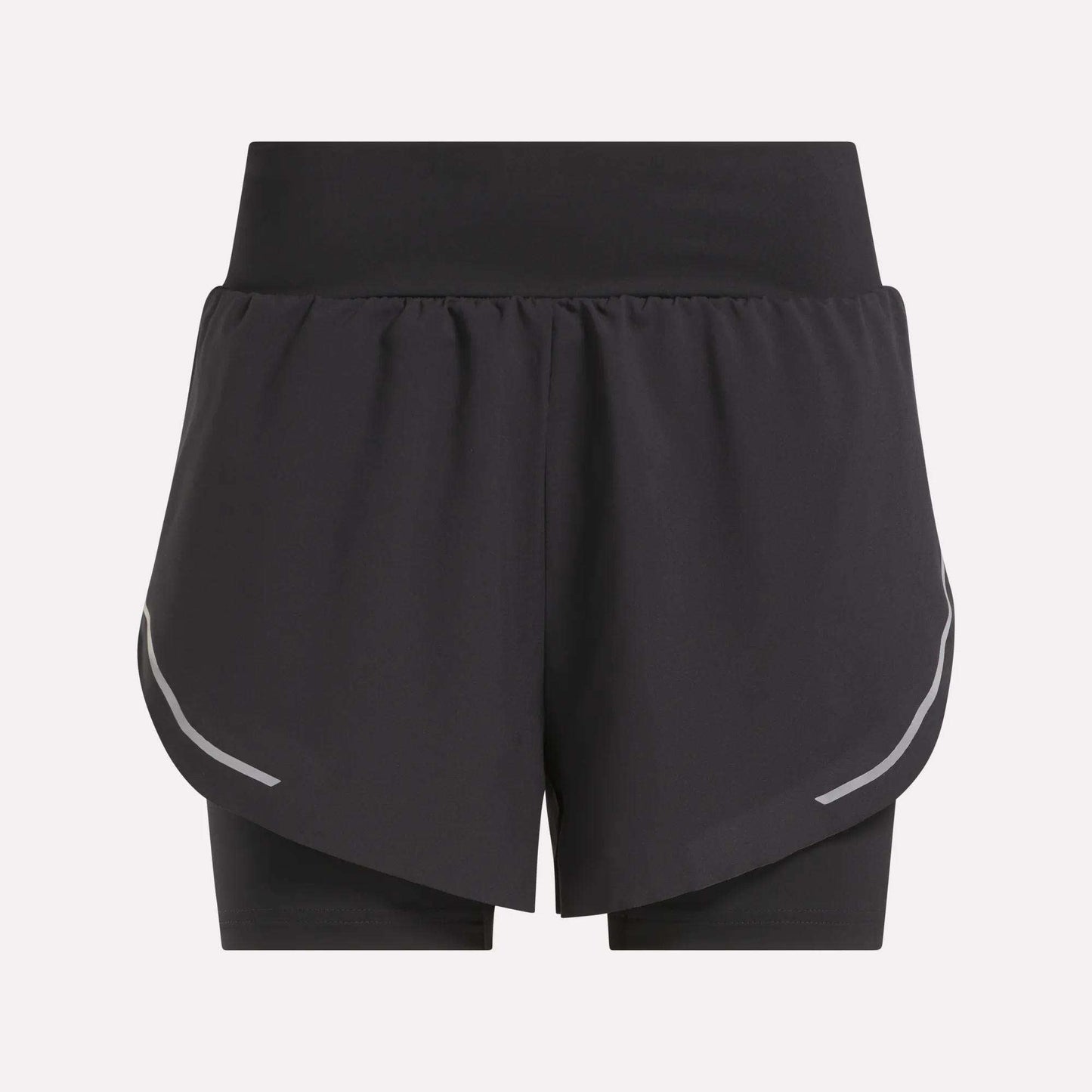 The Reebok Women's Lux Metallic 2-in-1 Running Shorts 3" are black, high-waisted shorts with an overlapping front layer, reflective curved side stripes, and fitted inner shorts. Shown against a plain light gray background.