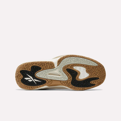 The image displays the outsole of the Reebok Engine A 26 Basketball Shoes, featuring a wavy, textured gum sole with black, white, and light gray sections in an abstract pattern for enhanced on-court stability.
