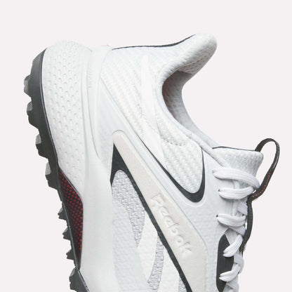 Reebok Nano Golf Shoes with a lightweight FlexWeave upper, black accents, and a rugged traction sole. Features textured details and is shown from the side against a plain light background.