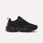 The Women's DMX Series 3000 Training Shoes by Reebok feature a black mesh and synthetic upper, chunky sole, lace-up front, and visible DMX 3 Technology air cushioning in the heel. Shown on a white background—perfect as advanced Reebok walking shoes.