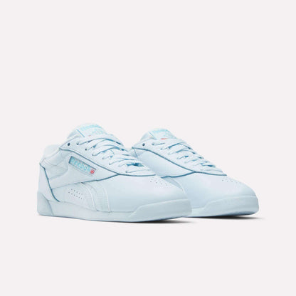 Women's Freestyle Lo Shoes by Reebok in light blue with white soles and the Reebok logo, ideal for everyday wear, shown against a plain white background.