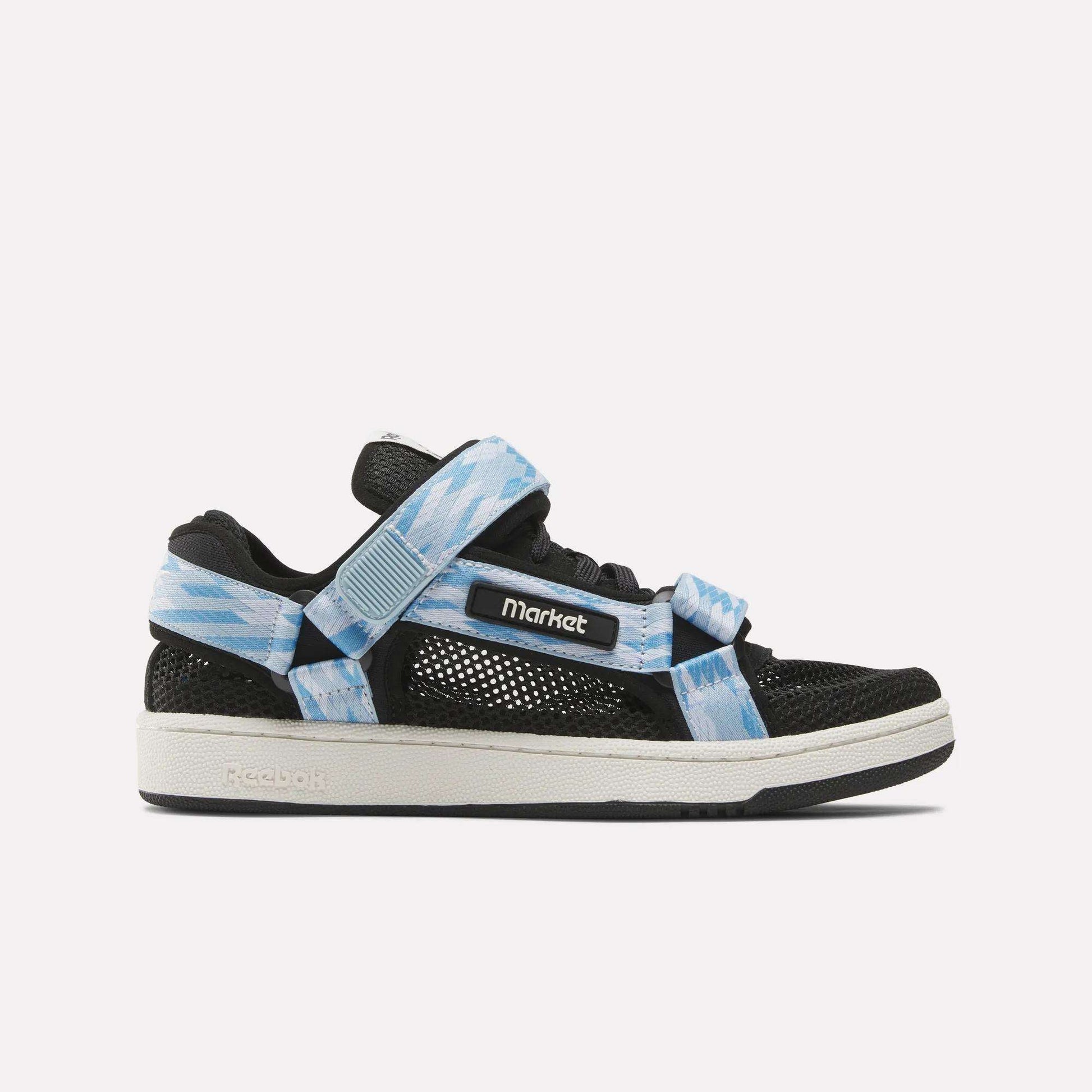 The Reebok x MARKET Club C 85 Shoes feature black mesh with a white sole, sky blue and white patterned straps, a MARKET label on the side, and Reebok branding, blending tennis-inspired style in this unique collaboration.