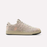 The Reebok x MARKET Club C 85 Shoes feature a beige design with a faded leaf pattern on the side, beige laces, and a tan sole. This low-top, court-inspired sneaker by Reebok is displayed against a plain white background.