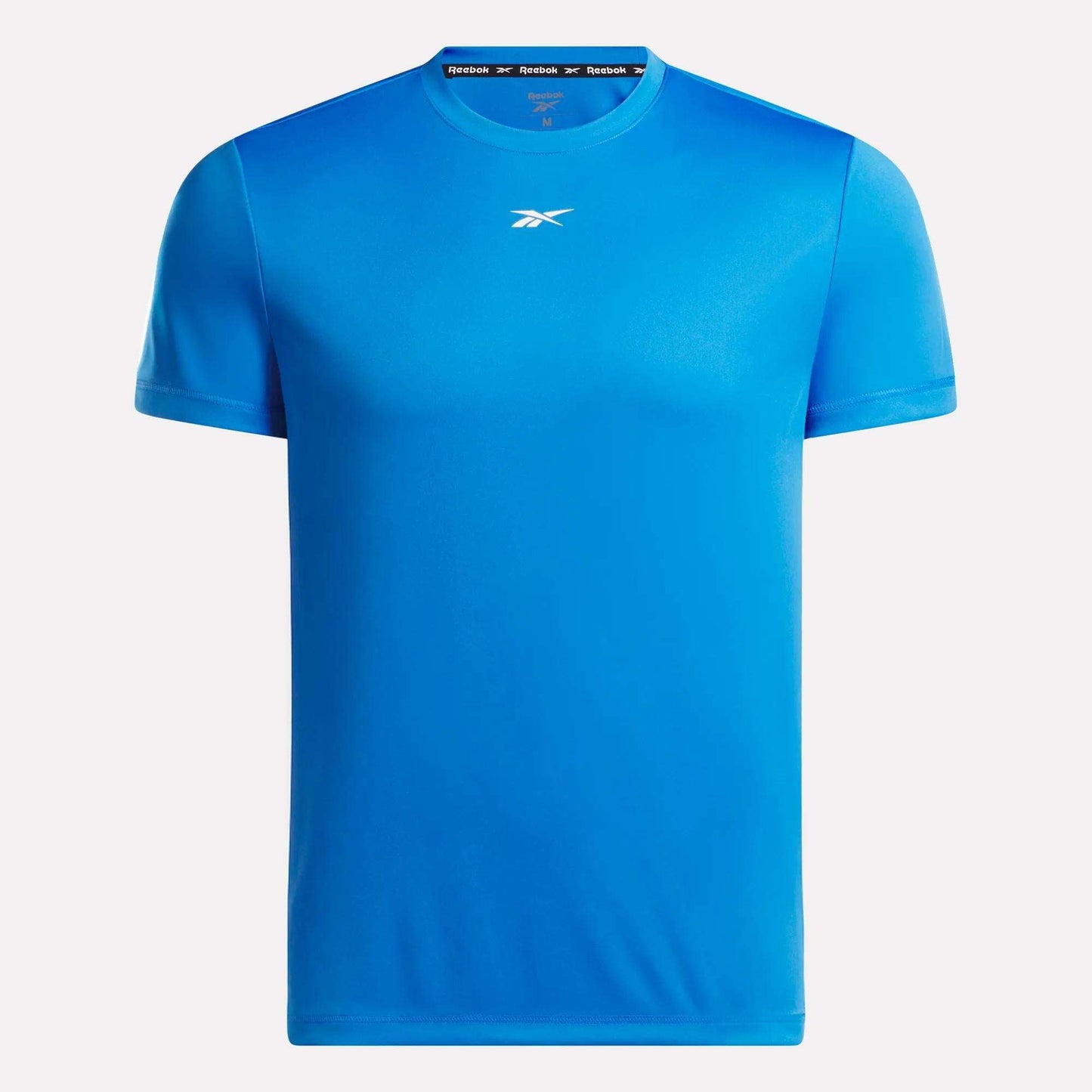 The Men's Short Sleeve Tech Training T-Shirt by Reebok features a bright blue color, small white chest logo, short sleeves, and RBK-DRY fabric for superior comfort, shown on a white background.