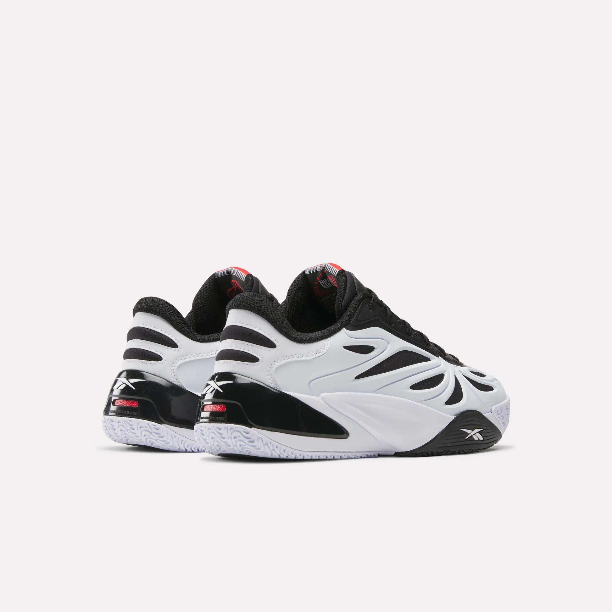 Two Reebok Angel Reese 1 Basketball Shoes in black, white, and red are shown on a white background, featuring the Reebok logo and Energy Return System—perfect for those seeking performance basketball shoes inspired by Angel Reese.