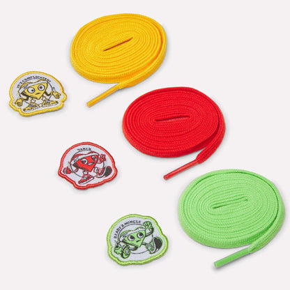 Three rolled shoelaces in yellow, red, and green, each with a matching embroidered cartoon patch—ideal for customizing your Reebok Men's FloatZig 2 SoleMates Running Shoes. All items are arranged on a white background.