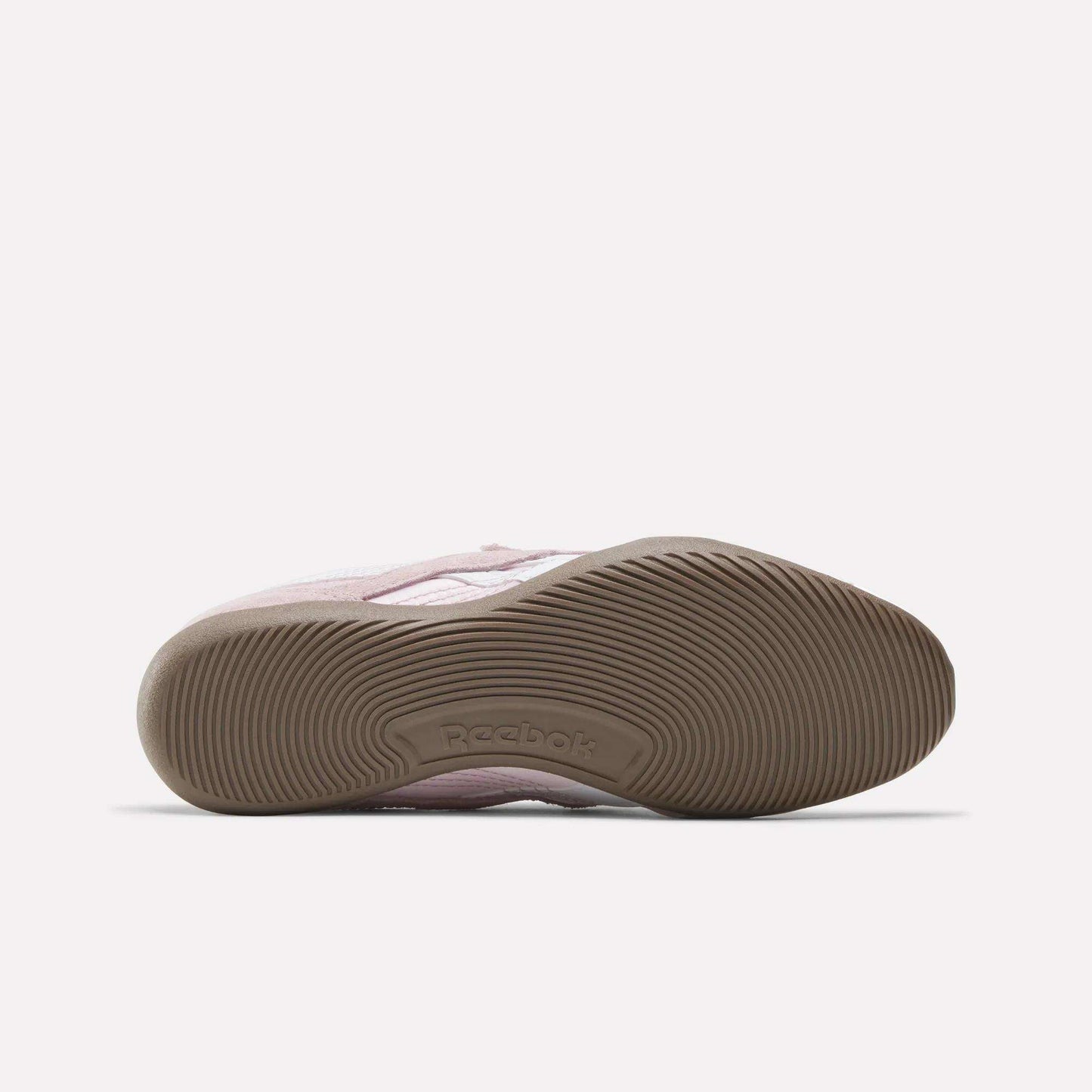 The Women's Ultra Lo Mary Jane Shoes by Reebok in pink feature a low-profile design, a textured brown rubber sole, and the Reebok logo embossed in the arch—classic everyday comfort with modern style.