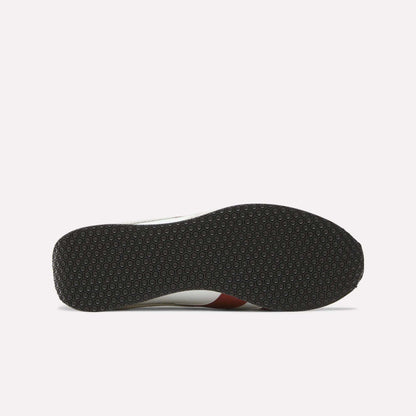 The image shows the bottom view of the Reebok R400 Shoes, featuring a black rubber sole with a repeating hexagonal pattern, a hallmark of many retro sneakers. The rest of the shoe is only partially visible from this angle.