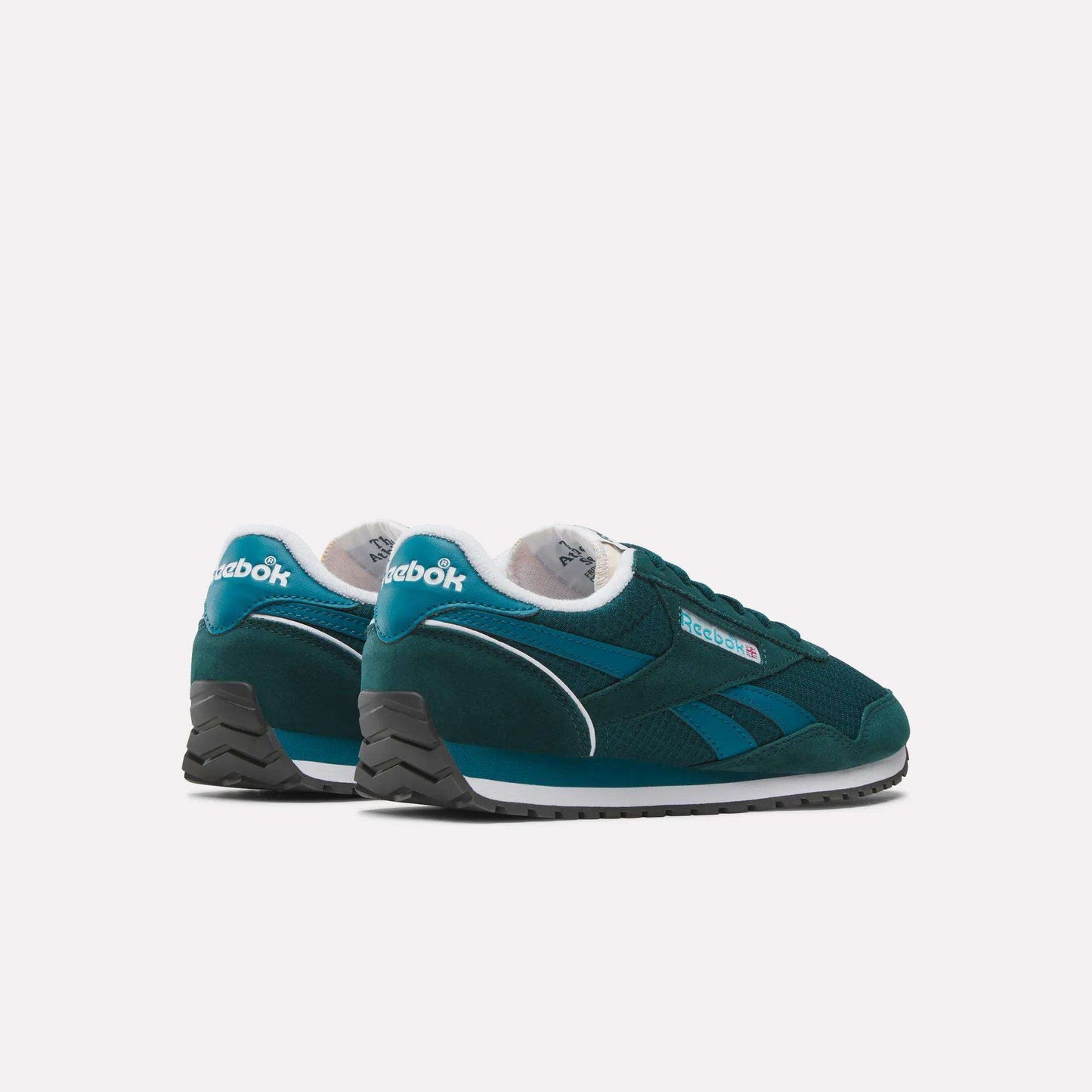 The Women's Classic AZ Shoes by Reebok feature a teal design with white midsoles, black outsoles, white accents, and visible Reebok branding on the heel and sides, showcasing heritage style against a plain white background.