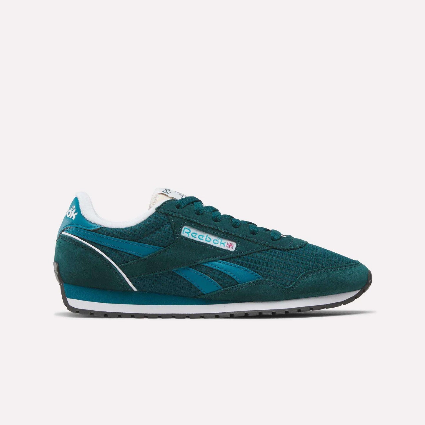 The Women's Classic AZ Shoes by Reebok feature a teal upper with blue accents, a white midsole, black outsole, and side branding. This low-top retro running-inspired sneaker is shown against a plain white background.