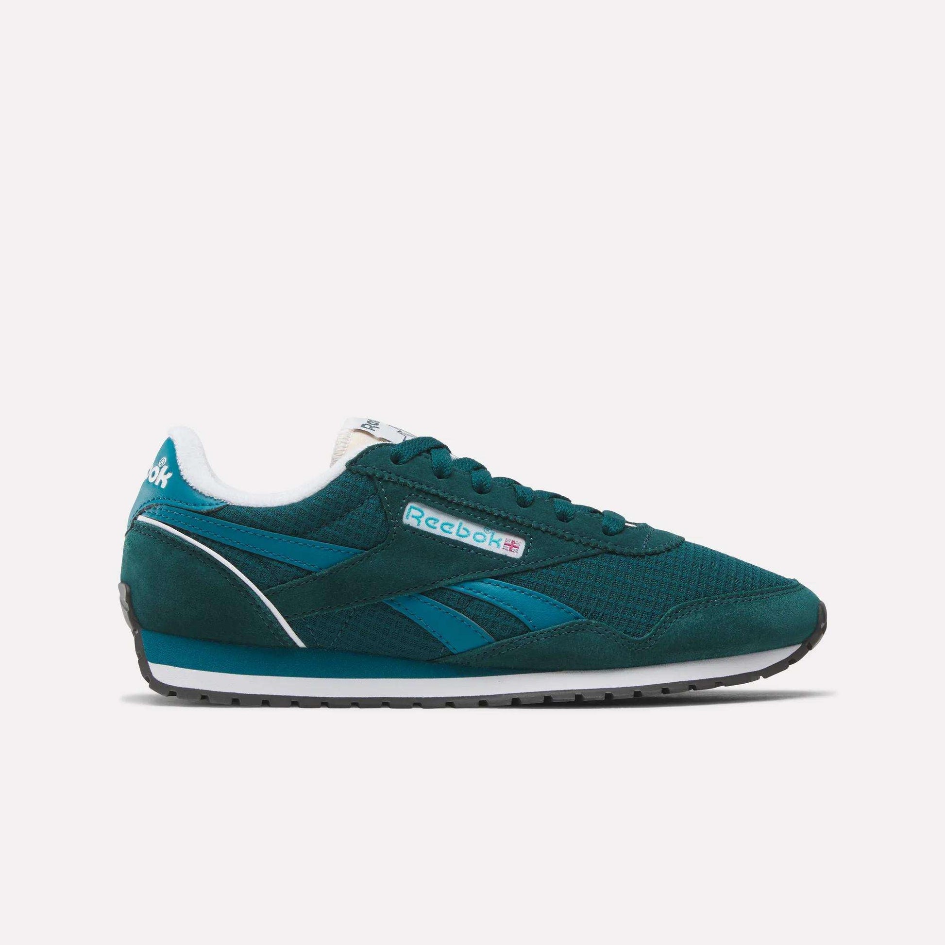 The Women's Classic AZ Shoes by Reebok feature a teal upper with blue accents, a white midsole, black outsole, and side branding. This low-top retro running-inspired sneaker is shown against a plain white background.