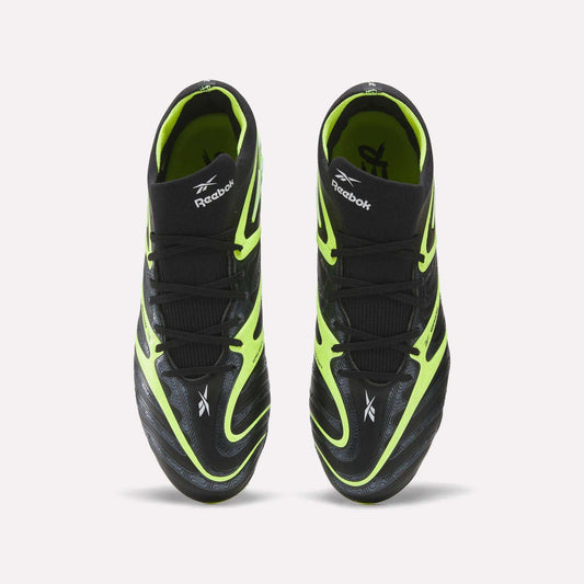 A pair of Reebok Sidewinder 26 Elite FG Cleats, shown from above, with black uppers, neon yellow accents, and white logos—designed for firm ground play and superior ball control.