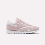 Showcased on a plain white background, the Reebok Women's Classic Nylon Shoes come in Elemental Pink with white accents and laces, featuring the iconic retro design and a white rubber sole—an ideal addition to any women's shoe collection.
