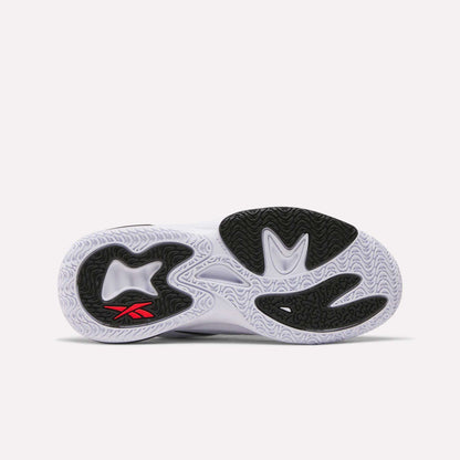 The image shows the sole of the Reebok Angel Reese 1 Shoes - Big Kids with a white base, black grip sections, and a small red Reebok logo by the heel. Wavy and textured tread lines offer great traction—ideal for kids’ basketball.