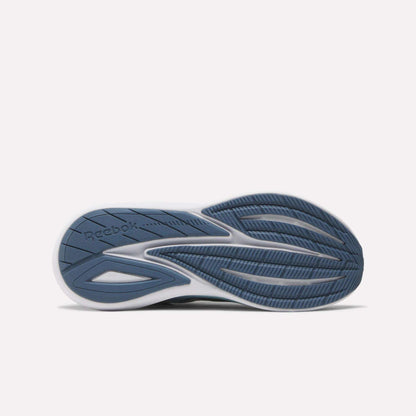 The image displays the sole of Reebok Women's Viva Speed Shoes with a blue and white design, textured and smooth patterns for traction, flexibility, added cushioning, and the Reebok logo on the left side.