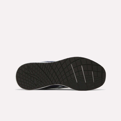 The image displays the sole of Reebok Men's Nanoflex Trainer 2 Shoes, featuring a textured grid-like pattern with grooves for traction, against a plain white background.