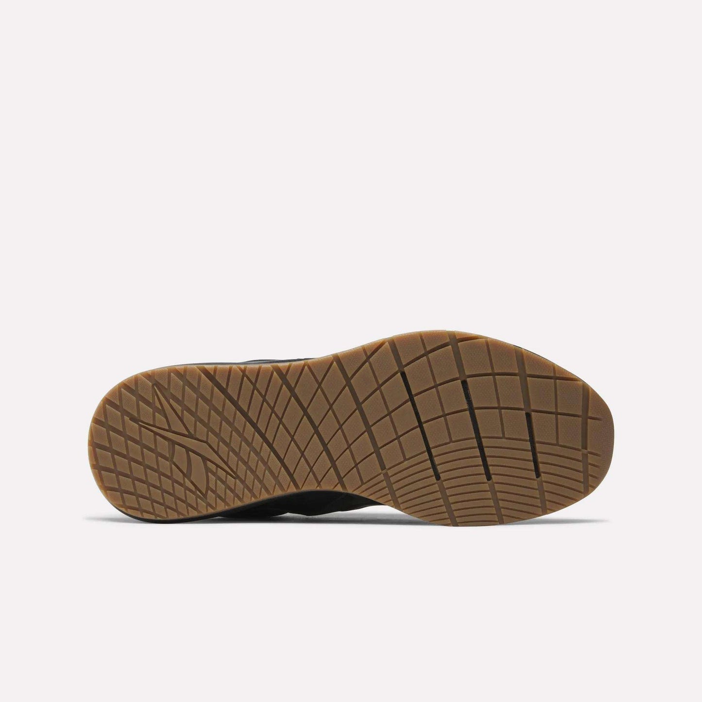 The image displays the sole of a Reebok Men's Nanoflex Trainer 2 Shoe, featuring a tan rubber bottom with a grid tread pattern, photographed against a plain white background.