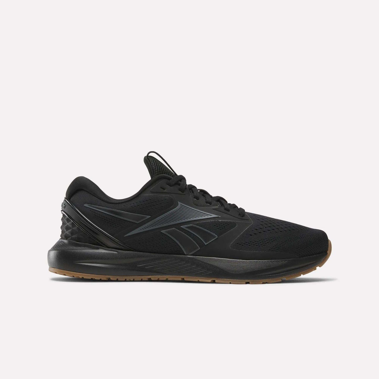 The Reebok Men's Nanoflex Trainer 2 Shoes in black feature a black sole, subtle gray lines, and the Reebok logo on the side—ideal athletic sneakers for any workout, shown here against a plain white background.