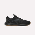 The Reebok Men's Nanoflex Trainer 2 Shoes in black feature a black sole, subtle gray lines, and the Reebok logo on the side—ideal athletic sneakers for any workout, shown here against a plain white background.