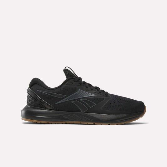 The Reebok Men's Nanoflex Trainer 2 Shoes in black feature a black sole, subtle gray lines, and the Reebok logo on the side—ideal athletic sneakers for any workout, shown here against a plain white background.