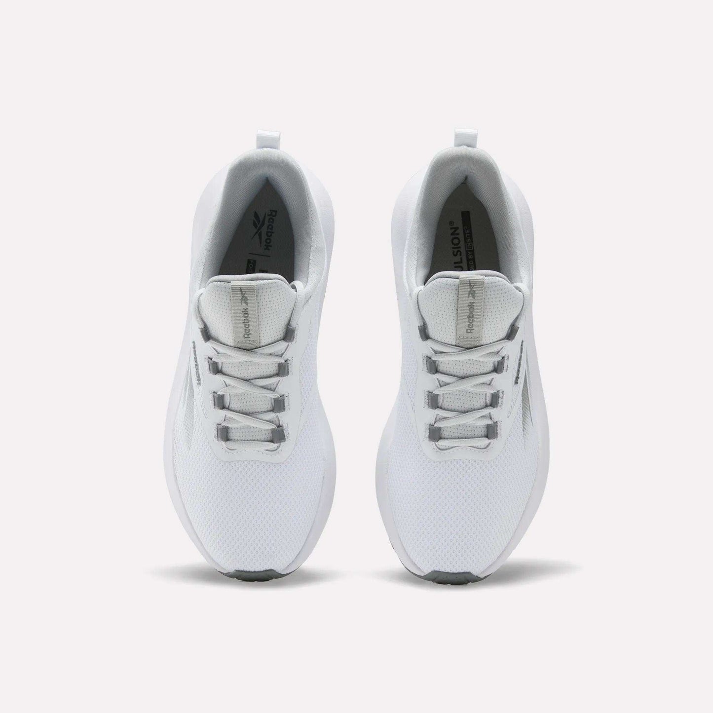 Top view of Reebok Men's Cityride 2 Running Shoes in white with light grey accents, mesh uppers, FuelFoam cushioning, and white laces, shown side by side on a plain light background.