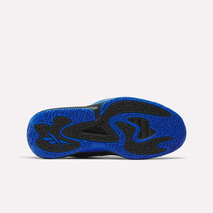 The image displays the bottom sole of the Reebok Engine A 26 Basketball Shoes, featuring a blue and black wavy pattern, a black Nike-style swoosh, and textured grip details for enhanced stability. The background is plain white.