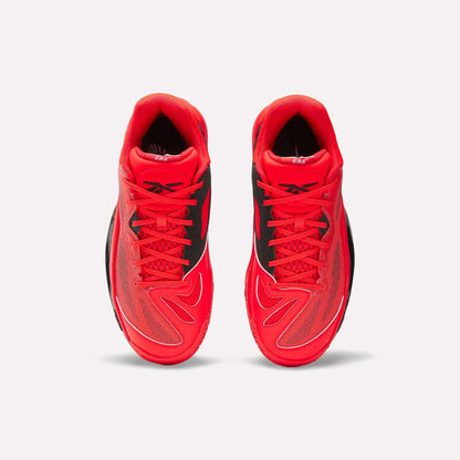 Top view of Reebok Engine A 26 Basketball Shoes in bright red with black and white accents, mesh panels for breathability, energy return cushioning, and the Reebok logo on the tongue, set against a white background.