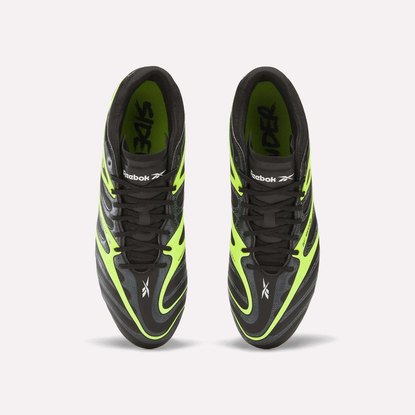 Reebok Sidewinder 26 Pro FG Cleats in black with neon green accents, seen from above. The shoes feature the Reebok logo and "RIDER" inside, crafted for firm ground to boost ball control like elite soccer cleats.