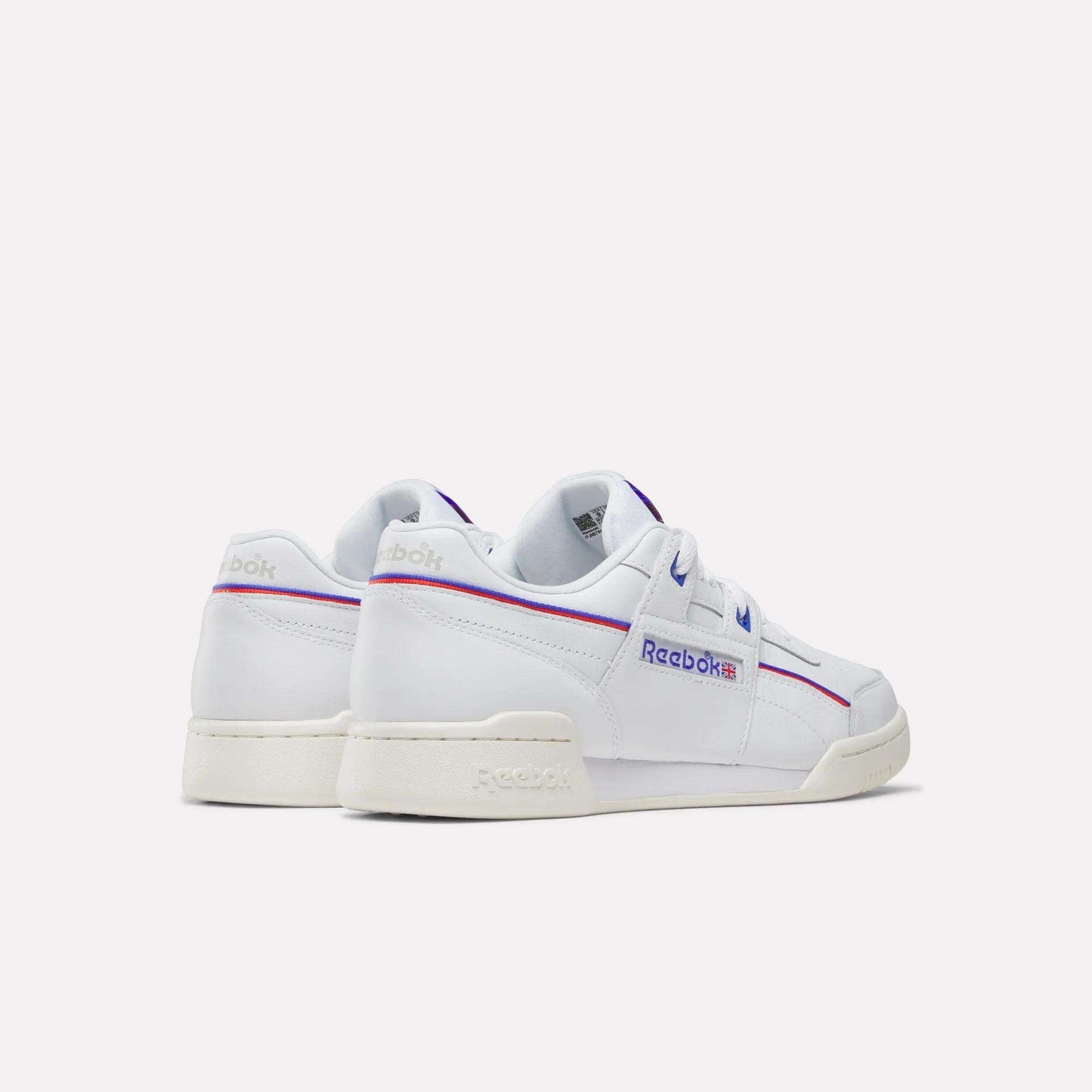 The Reebok Women's Club C 85 Shoes in white feature blue and red accents, shown from back and side angles on a simple background—an ideal choice for everyday women’s style.