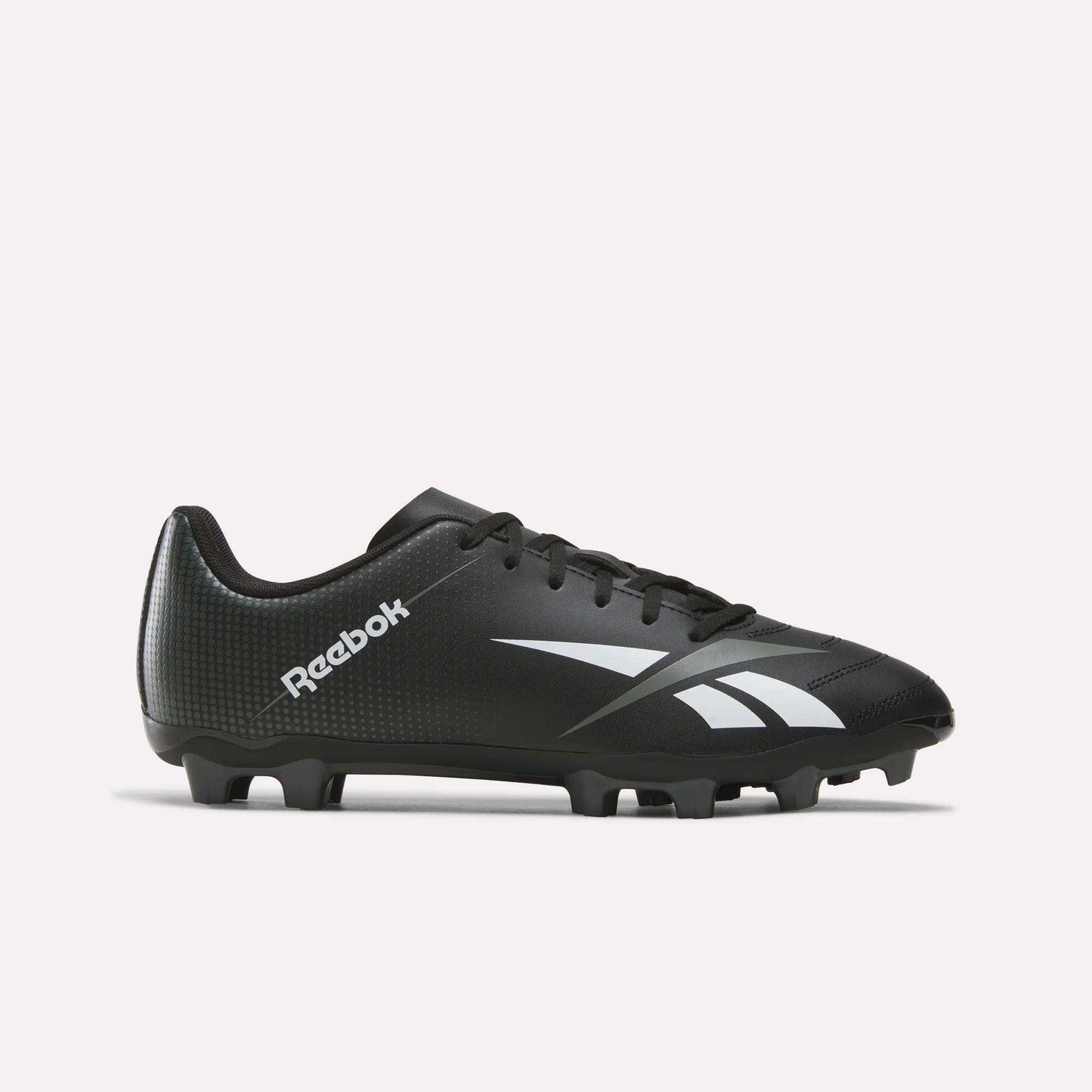 The Reebok Strike Multi Ground Soccer Cleats in black and grey—ideal for turf play—showcase classic white branding and logo, molded studs on the sole, and a secure lace-up design, all displayed against a plain white background.