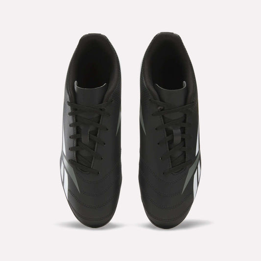 Top view of the Reebok Strike Multi Ground Soccer Cleats in black, featuring white side accents, black laces, and a dark inner lining, showcased on a plain white background—ideal soccer shoes for turf surfaces.