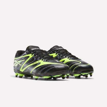 The Reebok Sidewinder 26 League FG Cleats for big kids feature a black and neon yellow striped design with firm ground studs, shown against a white background.