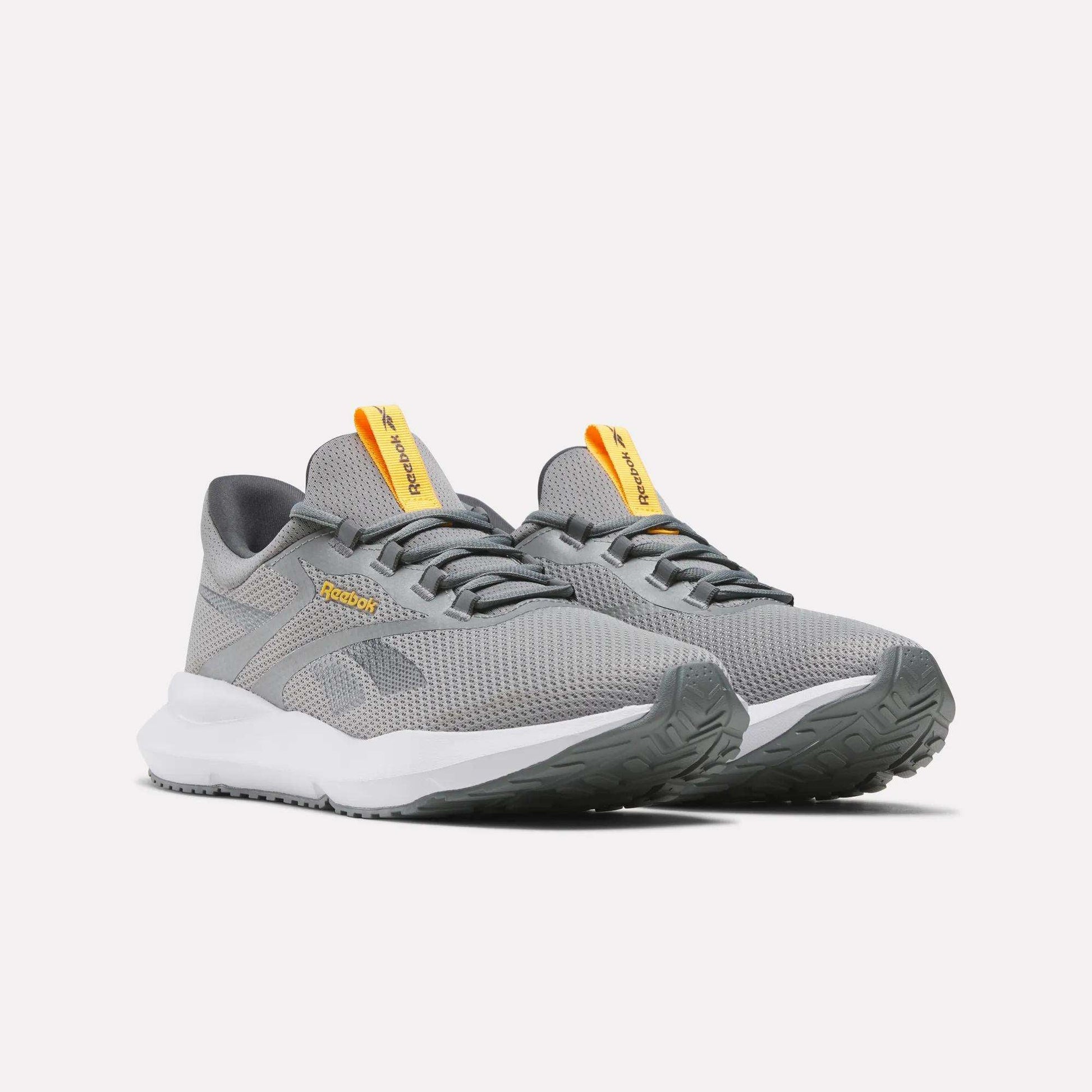 Men's Cityride 2 Running Shoes by Reebok, featuring gray mesh uppers, white soles, yellow tongue tags, and FuelFoam cushioning, are displayed on a plain white background.