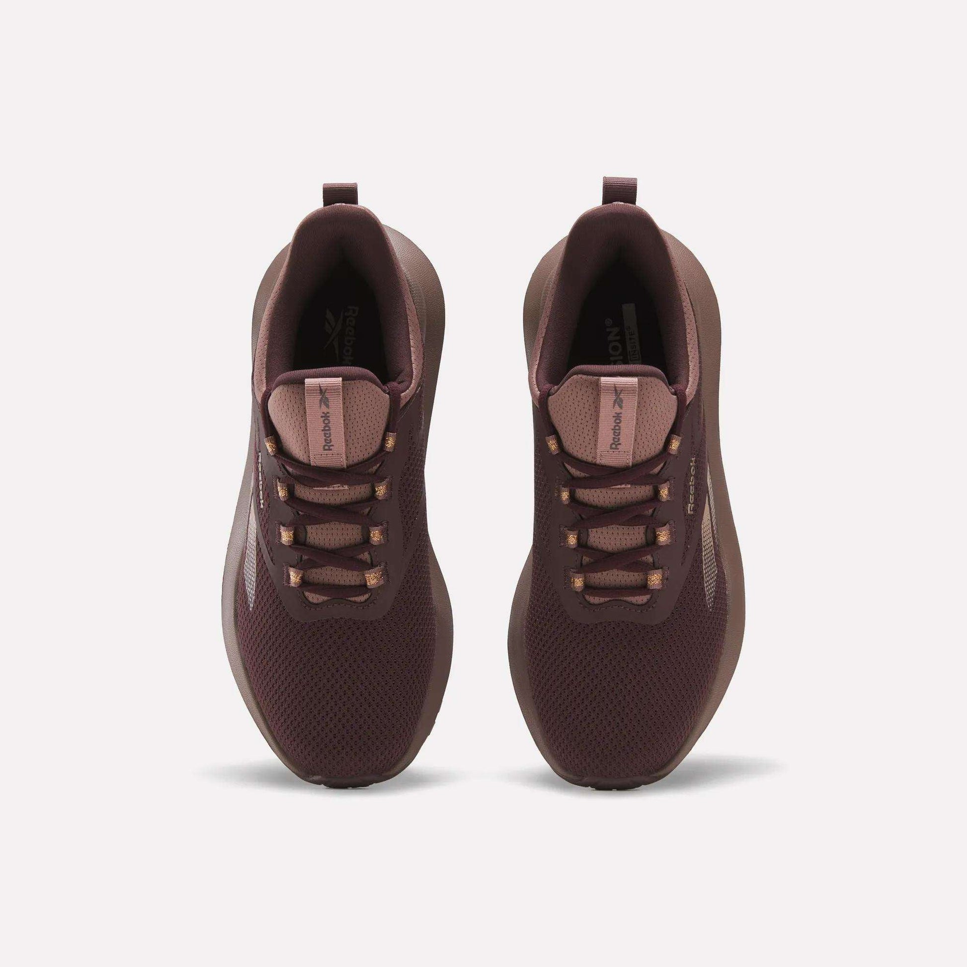 A pair of maroon Reebok Women's Cityride 2 Running Shoes shown from above, with mesh uppers, matching laces, subtle side and tongue logos, and FuelFoam cushioning, displayed against a plain white background.