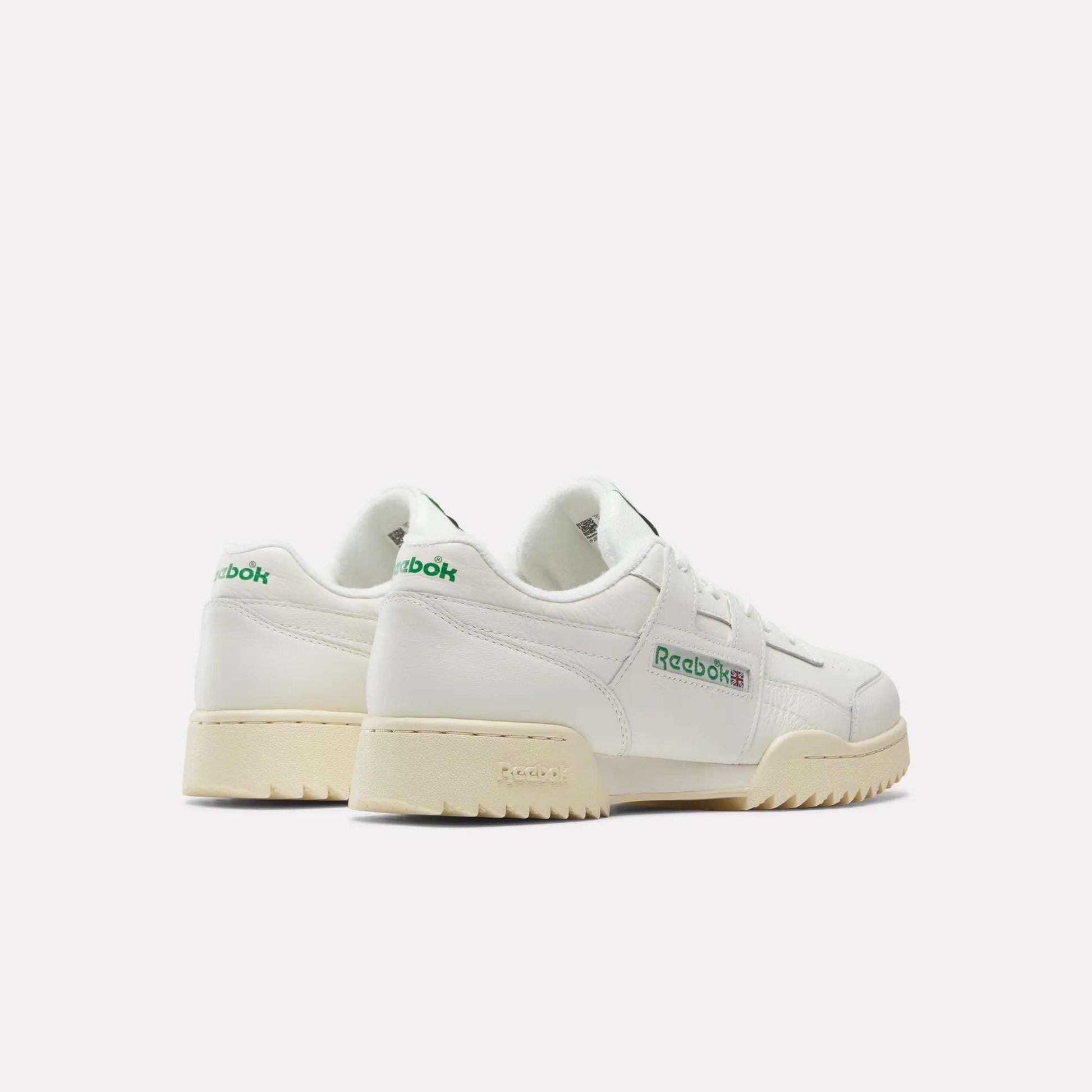 A pair of Reebok Workout Plus Ripple Shoes in vintage white, featuring green and blue logo details, displayed from a back and side angle on a plain white background.
