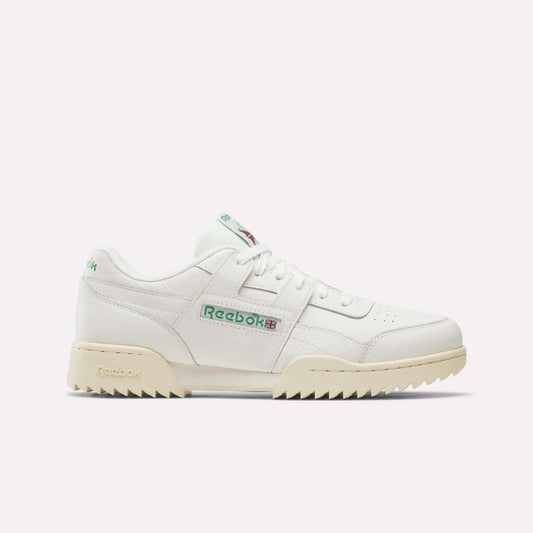 The Reebok Workout Plus Ripple Shoes in Chalk/Vintage Chalk/Paperwhite showcase a low-top silhouette with green logo accents, beige sole, perforated toe box, and chunky tread. Photographed side-on against a plain white background, these classic sneakers blend retro fitness style with enduring comfort.