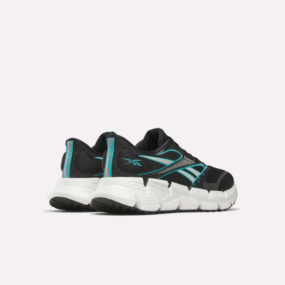 A pair of Reebok Men's FloatZig 2 Running Shoes in black with teal accents and white chunky soles, featuring Superfloat+ cushioning, shown from the back and side on a plain light background.
