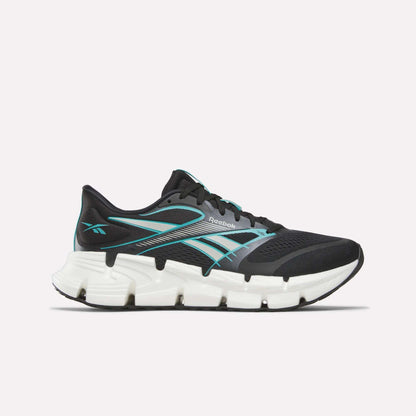 The Reebok Men's FloatZig 2 Running Shoes feature a black athletic design with teal accents and a thick, segmented white sole for energy-returning cushioning, shown in side profile against a plain light background.