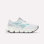 The Reebok Women's FloatZig 2 Running Shoes in White/Grey/White feature Superfloat+ cushioning, a segmented sole, and black outsole, shown in side profile on a plain white background.