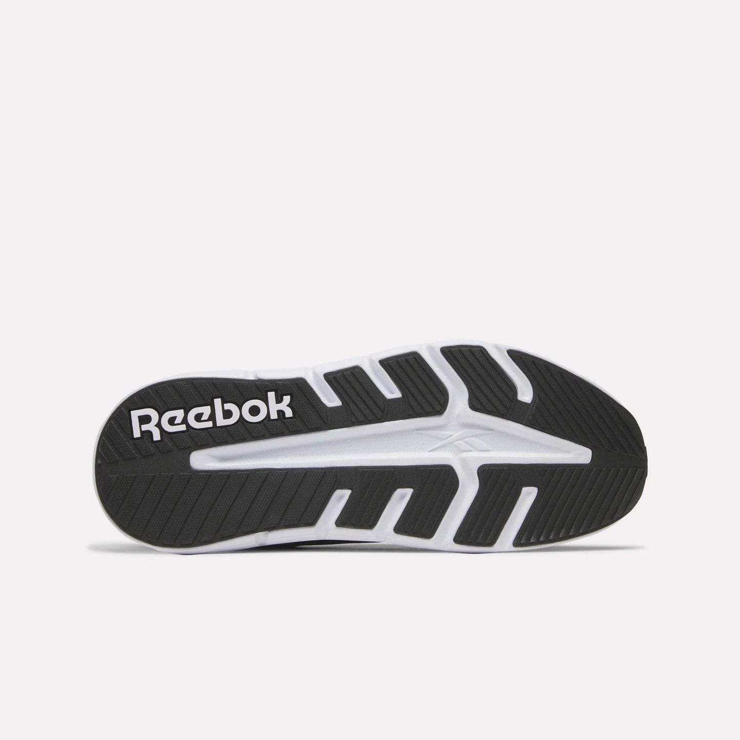 The image displays the black and white rubber sole of Reebok’s Nano Gym 2.0 Training Shoes, highlighting the brand logo and unique tread patterns designed for excellent grip.