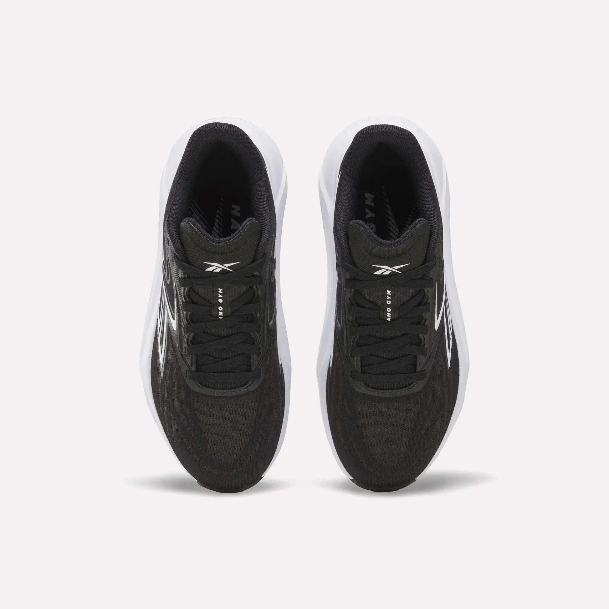 Top view of Women's Nano Gym 2.0 Training Shoes by Reebok, in black with white soles and subtle white branding on the tongue and sides, displayed against a plain white background.