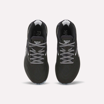 Top view of Reebok Women's Nano X5 Edge Training Shoes in black with white laces and accents, displayed side by side on a plain white background.