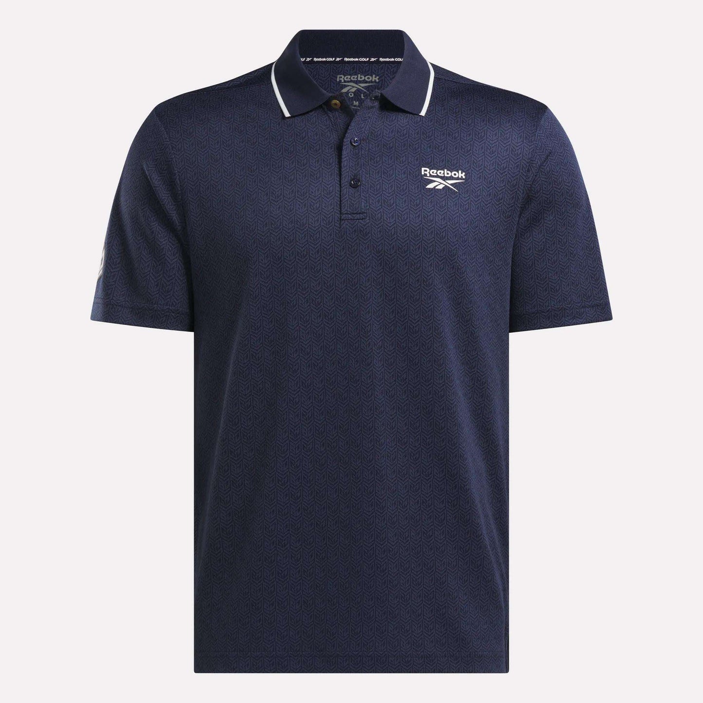The Men's BDC Signature Polo Shirt by Reebok is navy blue with a subtle pattern, white piping on the collar, and Reebok logos. Made from RBK-DRY fabric, it features a three-button placket and short sleeves for cool comfort.