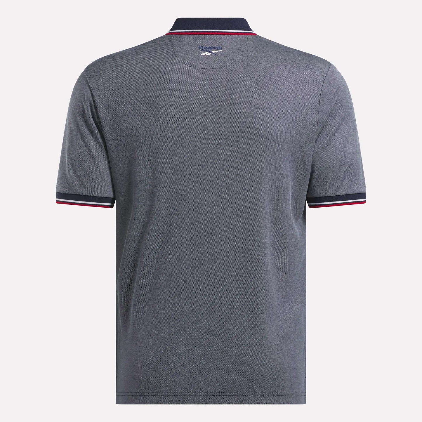 The Reebok Men's Country Club Oxford Pique Polo Shirt is shown from the back in gray with short sleeves, a dark collar and cuffs accented by white and pink trim, and the Reebok logo printed below the collar.