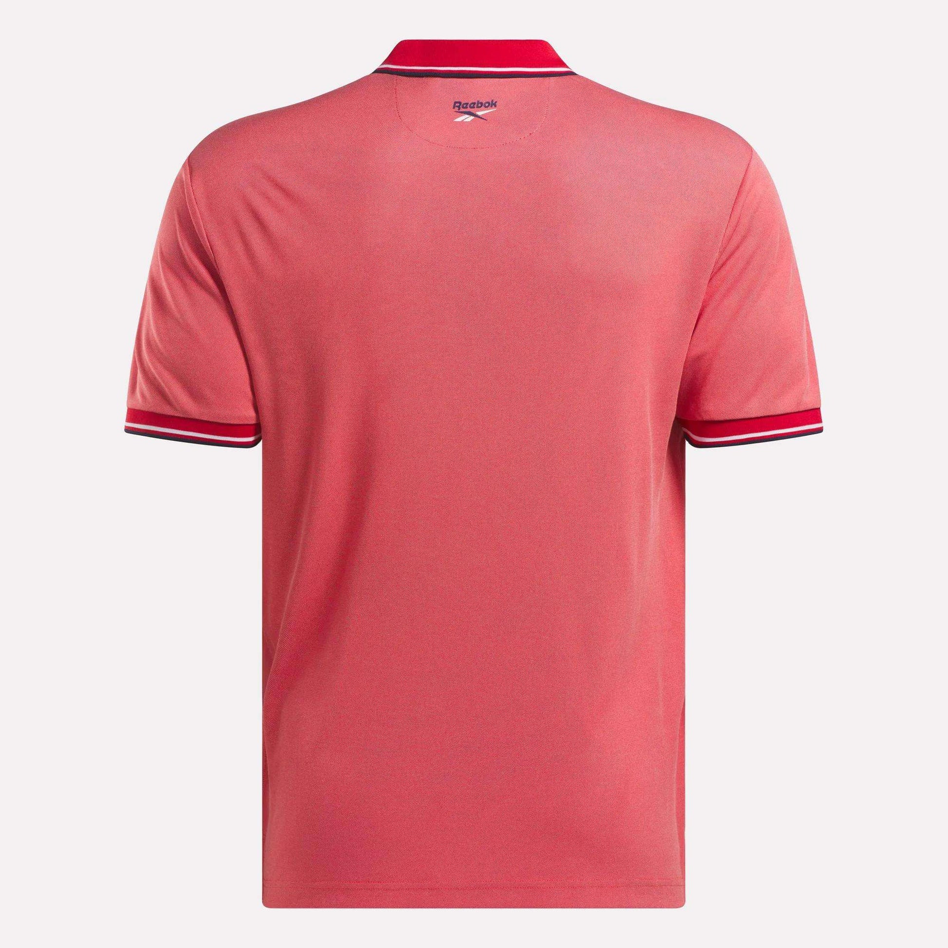 The Men's Country Club Oxford Pique Polo Shirt by Reebok boasts a sleek logo and is ideal for casual outings or the golf course.