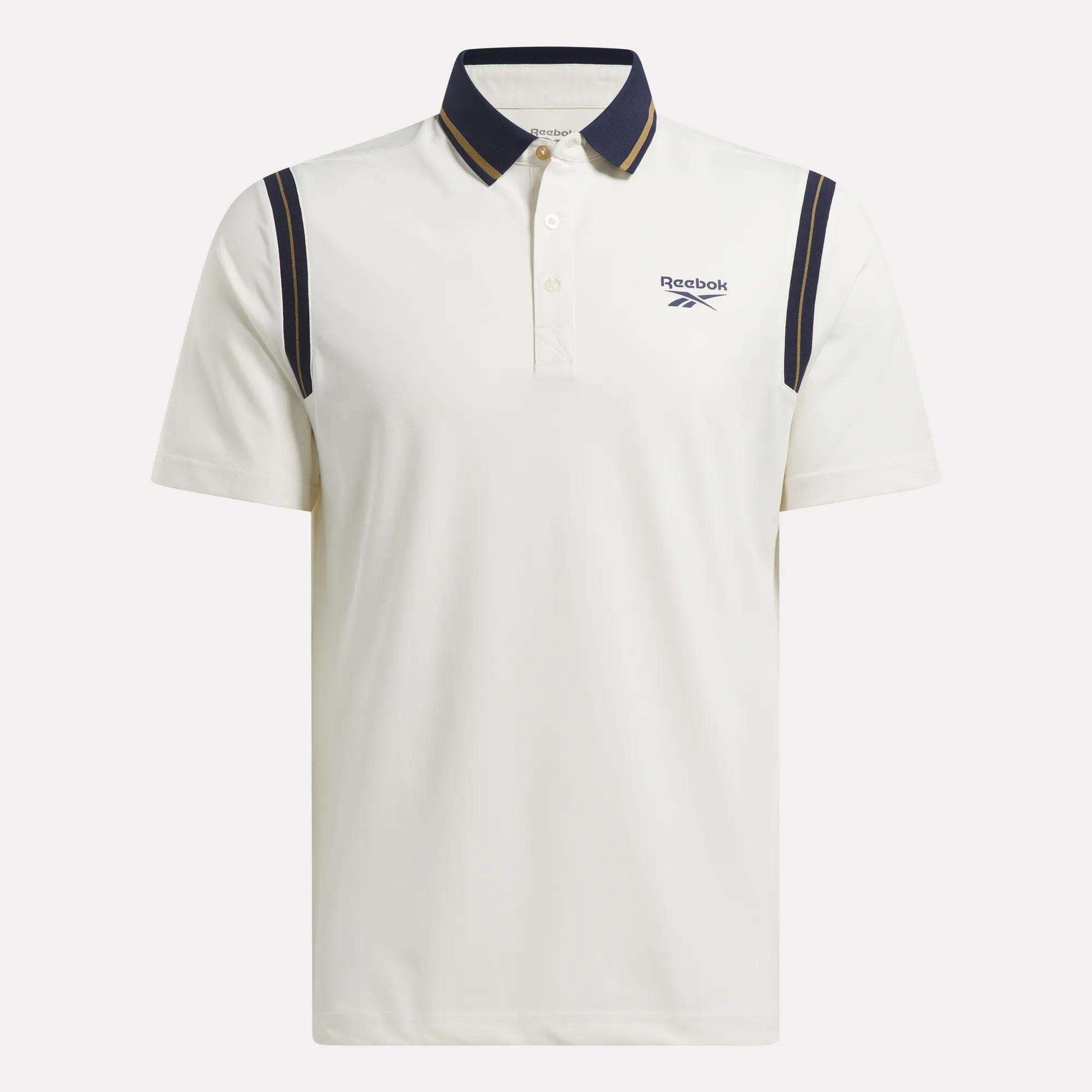 The Men's Varsity Polo Shirt by Reebok features RBK-DRY fabric for comfort, a dark blue collar and shoulder stripes, small left-chest logo, short sleeves, and button-up placket—ideal as a stylish golf polo.