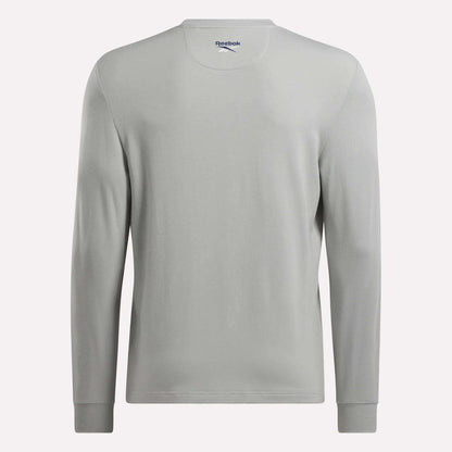 A plain light gray Men's Long Sleeve Golf Sweatshirt by Reebok is shown from the back. It features subtle stitching, a crew neckline, UPF 30+ protection, and the Reebok logo printed inside the collar.