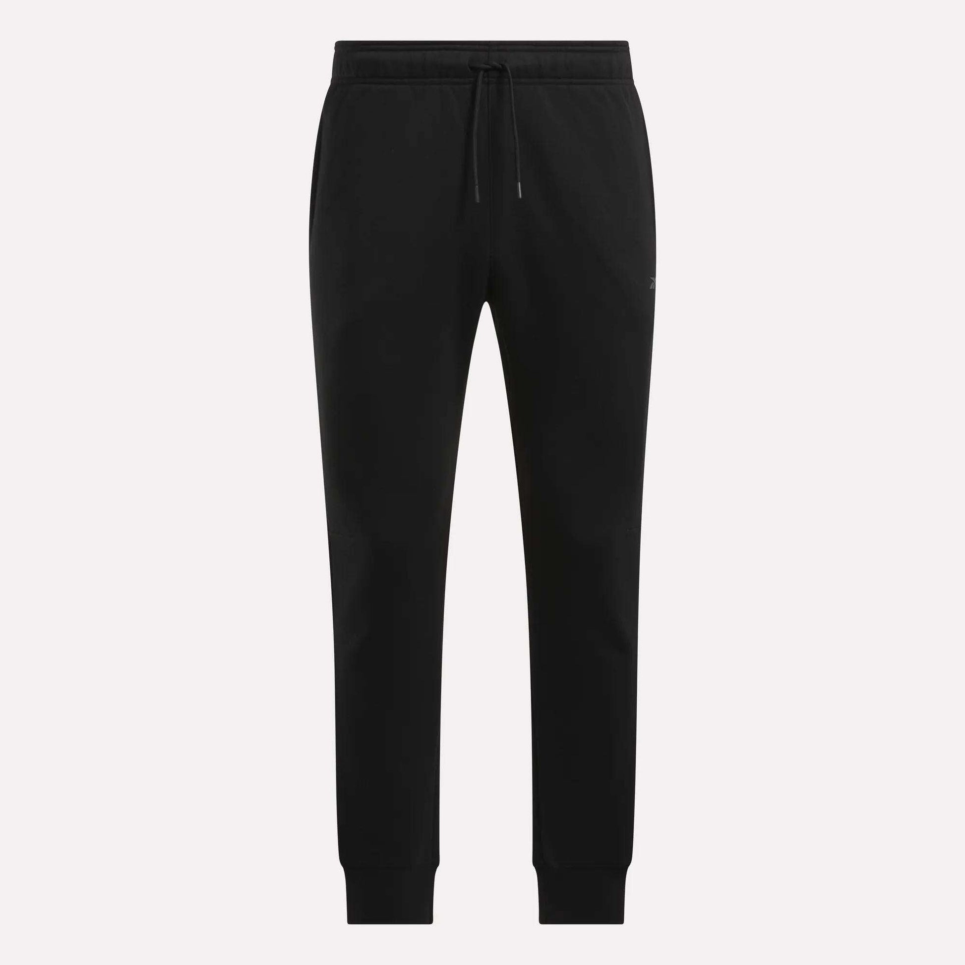 Reebok Men's Motion Joggers in black, featuring a slim fit, elastic waistband with drawstring tie, side pockets, and fitted cuffs, displayed on a plain white background.