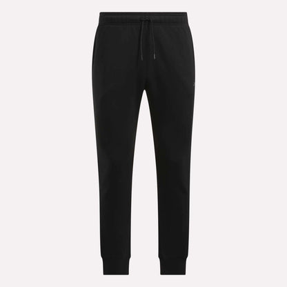 Reebok Men's Motion Joggers in black, featuring a slim fit, elastic waistband with drawstring tie, side pockets, and fitted cuffs, displayed on a plain white background.