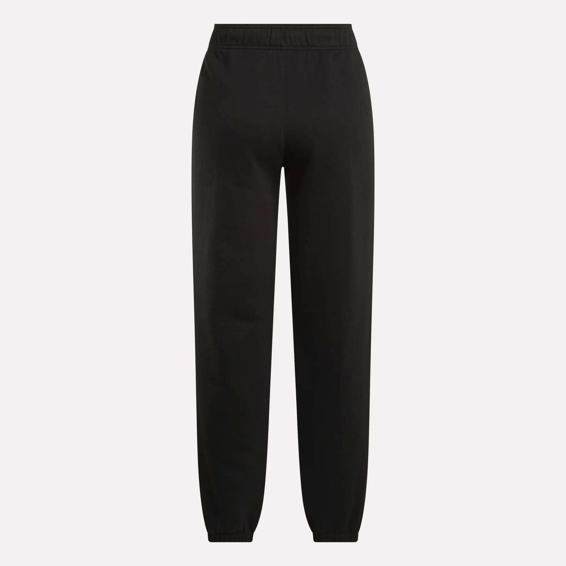 The Reebok Women's Medium Vector Sweatpants, made from a comfy cotton-blend with an elastic waistband and ankle cuffs, are showcased against a plain light background.